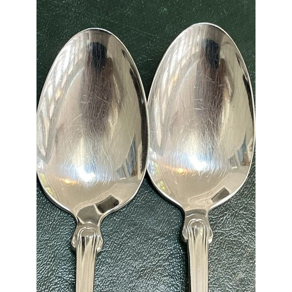 Reed & Barton Colonial Shell stainless-steel oval soup/place spoons.